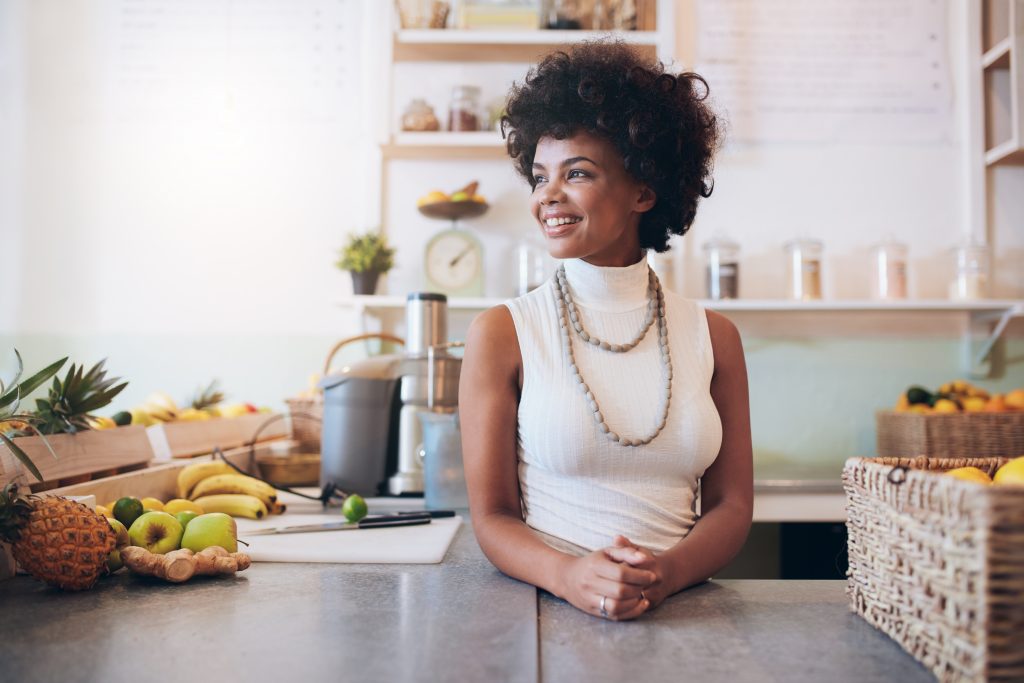 Portrait Of Beautiful Young Woman Working At Juice Bar She